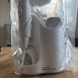 Waterpik Water Flosser in Sealed Package